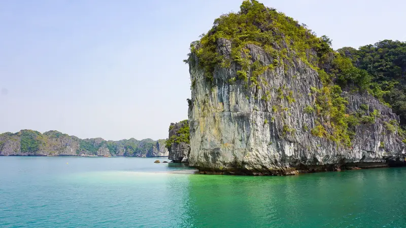 High tide on Halong Bay means that small beaches like this one are submerged. 